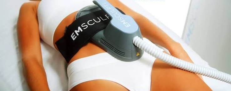 Emsculpt Neo applicator resting on the abdomen during a treatment